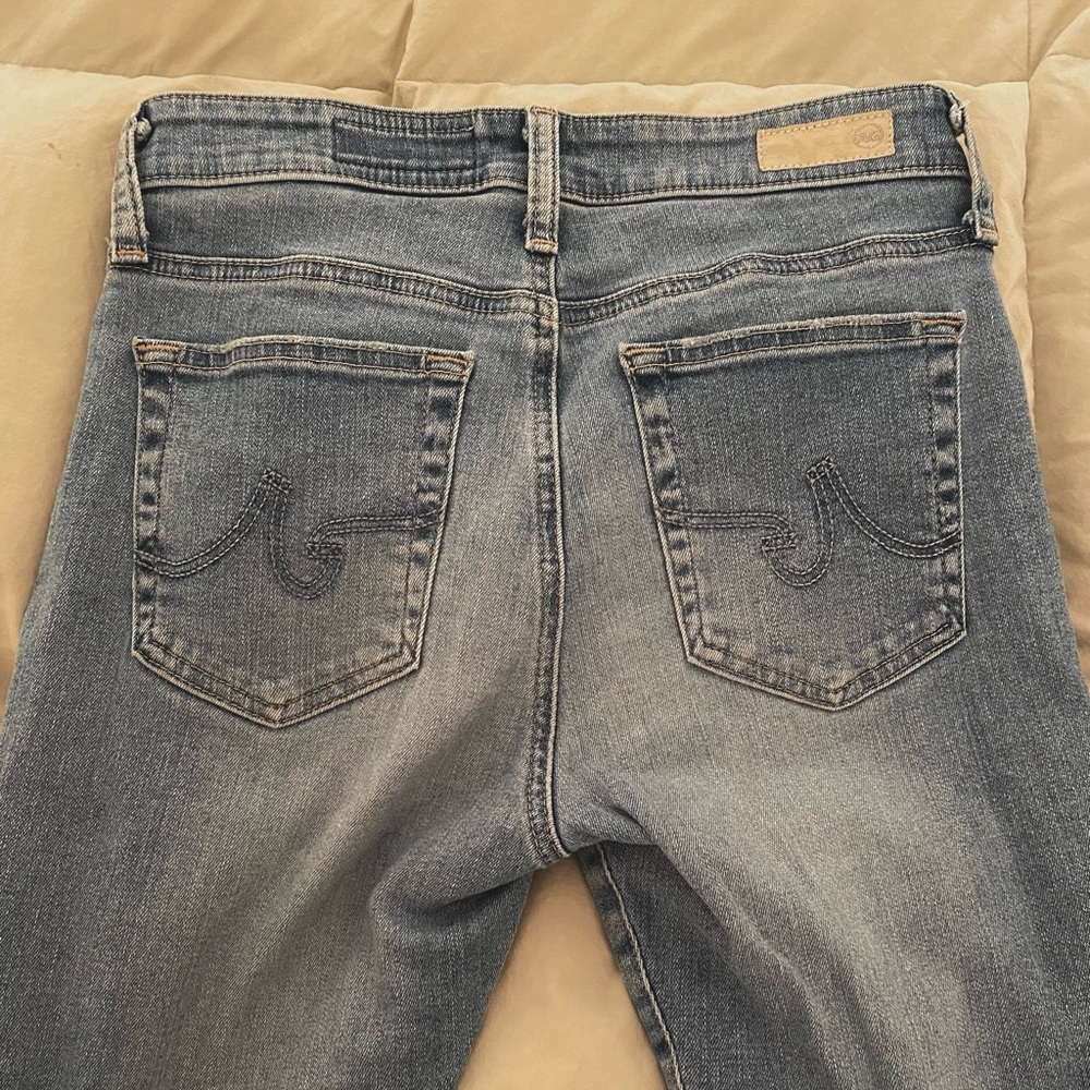 AG light denim skinny jeans with frayed ankle